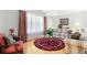 Cozy living room with hardwood floors, sofas, and large windows at 1426 Sc-45, McClellanville, SC 29458