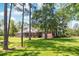 Spacious backyard with screened porch and lush lawn at 1426 Sc-45, McClellanville, SC 29458