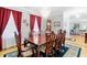 Elegant dining room with hardwood floors, chandelier, and large windows at 1426 Sc-45, McClellanville, SC 29458
