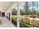 Spacious front porch with view of lush green landscape at 1426 Sc-45, McClellanville, SC 29458