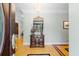 Elegant entryway with hardwood floors and antique furniture at 1426 Sc-45, McClellanville, SC 29458