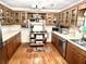 Kitchen with wood cabinets, vintage stove, and modern appliances at 138 Waddell Ln, Ridgeville, SC 29472