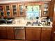 Kitchen with wood cabinets, sink, and window at 138 Waddell Ln, Ridgeville, SC 29472