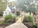Charming white house exterior with porch and bridge at 138 Waddell Ln, Ridgeville, SC 29472