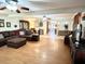 Spacious living room with a brown sectional sofa and hardwood floors at 138 Waddell Ln, Ridgeville, SC 29472