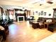 Spacious living room featuring hardwood floors, a fireplace, and comfortable leather furniture at 138 Waddell Ln, Ridgeville, SC 29472