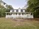 Two-story home with wrap-around porch and large yard at 138 Waddell Ln, Ridgeville, SC 29472