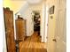 Long hallway with wood floors and access to other rooms at 138 Waddell Ln, Ridgeville, SC 29472