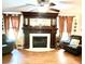 Living room featuring a fireplace, hardwood floors, and comfortable seating at 138 Waddell Ln, Ridgeville, SC 29472
