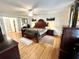 Spacious main bedroom with hardwood floors, large bed, and ample storage at 138 Waddell Ln, Ridgeville, SC 29472