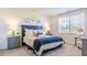Spacious main bedroom with a king-size bed and plenty of natural light at 159 Morning View Way, Moncks Corner, SC 29461
