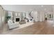 Bright living room with hardwood floors, fireplace, and stylish furniture at 1714 Cultivation Ln # 537, Mount Pleasant, SC 29466