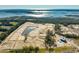 Aerial view of new homes under construction near the water, featuring a pond and community amenities at 1714 Cultivation Ln # 537, Mount Pleasant, SC 29466