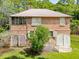 House with screened porch, wooden siding, and a detached garage at 712 W Ashley Ave, Folly Beach, SC 29439