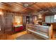 Rustic living room with wood walls, floors, and ceiling at 712 W Ashley Ave, Folly Beach, SC 29439