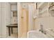 Small bathroom with shower, sink, and simple white fixtures at 712 W Ashley Ave, Folly Beach, SC 29439