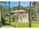 Charming two-story house nestled among lush greenery at 712 W Ashley Ave, Folly Beach, SC 29439