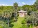 Secluded beach cottage with spacious yard and lush landscaping at 712 W Ashley Ave, Folly Beach, SC 29439
