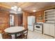 Rustic kitchen with white appliances and wood details at 712 W Ashley Ave, Folly Beach, SC 29439
