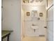 Simple bathroom with shower, sink, and vintage decor at 712 W Ashley Ave, Folly Beach, SC 29439