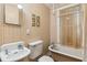 Simple bathroom with vintage tub, sink, and toilet at 712 W Ashley Ave, Folly Beach, SC 29439