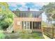 Two-story house with screened porch and wooden siding at 712 W Ashley Ave, Folly Beach, SC 29439