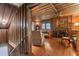 Rustic living room with wood walls, fireplace, and comfy seating at 712 W Ashley Ave, Folly Beach, SC 29439
