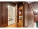 Wooden hallway with doors leading to bathroom and bedroom at 712 W Ashley Ave, Folly Beach, SC 29439
