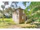 Quaint beach cottage nestled amongst lush greenery at 712 W Ashley Ave, Folly Beach, SC 29439