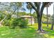 Two-story house with wood siding and a large yard at 712 W Ashley Ave, Folly Beach, SC 29439