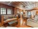 Spacious living room featuring wooden walls and hardwood floors at 712 W Ashley Ave, Folly Beach, SC 29439