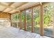 Screened porch overlooking backyard at 712 W Ashley Ave, Folly Beach, SC 29439