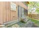 Exterior view of a house with weathered wood siding and screened porch at 712 W Ashley Ave, Folly Beach, SC 29439