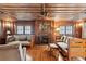 Rustic living room with wooden details and a fireplace at 712 W Ashley Ave, Folly Beach, SC 29439