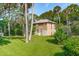 Two-story house with wood siding and a large yard at 712 W Ashley Ave, Folly Beach, SC 29439