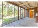 Screened porch with access to backyard at 712 W Ashley Ave, Folly Beach, SC 29439