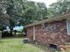 Brick home exterior with AC unit and mature trees at 1056 Yorktown Dr, Charleston, SC 29412