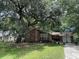 Brick house with large tree and driveway at 1056 Yorktown Dr, Charleston, SC 29412