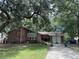 Brick house with large tree and driveway at 1056 Yorktown Dr, Charleston, SC 29412
