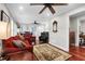 Spacious living room featuring hardwood floors, comfortable seating, and a ceiling fan at 118 E Ashley And 110 E Cooper Ave Ave, Folly Beach, SC 29439