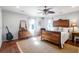 Cozy bedroom with hardwood floors, antique bed, and ample natural light at 118 E Ashley And 110 E Cooper Ave Ave, Folly Beach, SC 29439
