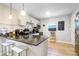 Modern kitchen featuring dark countertops and white cabinetry at 118 E Ashley And 110 E Cooper Ave Ave, Folly Beach, SC 29439