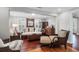 Bright and airy living room with hardwood floors and ample natural light at 118 E Ashley And 110 E Cooper Ave Ave, Folly Beach, SC 29439