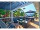 Relaxing deck with pergola, seating, and swing at 118 E Ashley And 110 E Cooper Ave Ave, Folly Beach, SC 29439