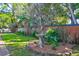 Landscaped backyard with birdbath and garden at 118 E Ashley And 110 E Cooper Ave Ave, Folly Beach, SC 29439