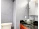 Contemporary bathroom with glass vessel sink and dark vanity at 118 E Ashley And 110 E Cooper Ave Ave, Folly Beach, SC 29439