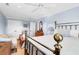 Spacious bedroom with brass bed frame and sitting area at 118 E Ashley And 110 E Cooper Ave Ave, Folly Beach, SC 29439