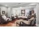 Cozy living room features hardwood floors, comfy seating, and a charming atmosphere at 118 E Ashley And 110 E Cooper Ave Ave, Folly Beach, SC 29439