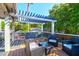 Deck with pergola, seating area, and neighborhood view at 118 E Ashley And 110 E Cooper Ave Ave, Folly Beach, SC 29439