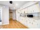 Classic kitchen with white cabinets and granite countertops at 118 E Ashley And 110 E Cooper Ave Ave, Folly Beach, SC 29439